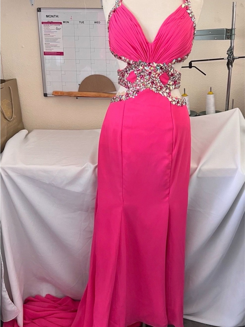 Elegant Fuchsia Cutout Evening Gown with Embellished Waist